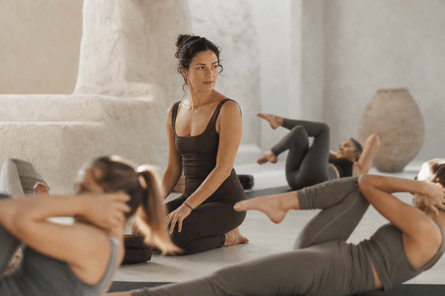 Instructor reading the room while leading a mat class